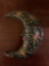 Papier-mache crescent moon with face