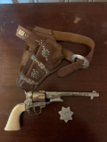 Colt 45 cap gun with leather holster and Wells Fargo agent star