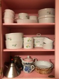 Cabinet lot includes tea kettles, Arabia bowls and anchor ovenware