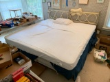 King size bed with two twin brass headboards