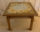 Side table with glass top and gilded artwork