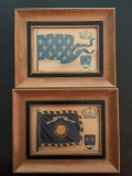 Group of two framed family crests