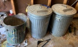 Group of three galvanized metal garbage cans