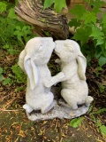 Plastic bunnies kissing yard ornament