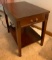 Wooden side table with drawer