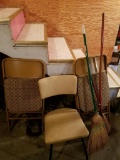 three chairs and three brooms.