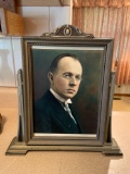 Photo of a man with glasses in an antique frame