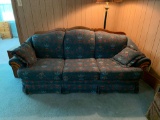 Floral pattern couch with wood back