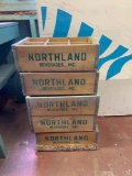 Group of five Northland beverages milk crates