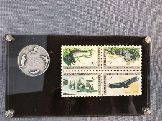 Wildlife Conservation Stamps with coin