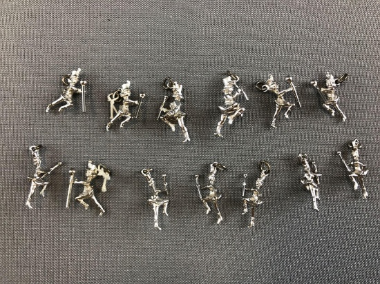 Group of 13 drum major sterling silver pendants