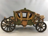Vintage wooden carriage with moving metal wheels