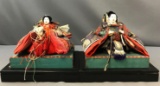 Pair of Vintage Asian ceremonial dolls on vases