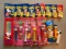 Group of Peanuts Pez dispensers, flashlights, and straws