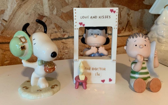 Group of four Lenox Peanuts porcelain figurines