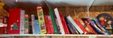 Shelf lot of miscellaneous peanuts puzzles, games, and more