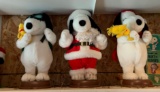 Group of three peanuts Christmas snoopy animatronic dolls