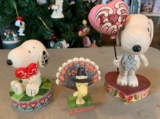 Group of three peanuts Jim Shore Snoopy and Woodstock figurines