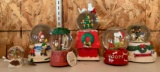 Group of six Peanuts Christmas snow globes