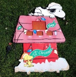 Snoopy Christmas-themed lawn ornament