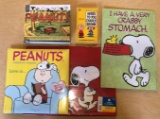 Group of Peanuts books calendars