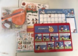 Group of Peanuts window clings, placemat, calendar, stickers