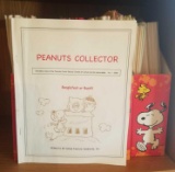 Dozens of Peanuts Snoopy Collector Guides