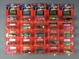 Group of 25 Johnny Lightning Promo and Special Edition Die-Cast Vehicles In Original Packages