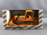 Group of 3 Tomy Heavy Equipment die cast Vehicles in original packaging