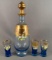 Vintage four piece glass decanter set with enamel floral design