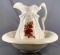Vintage water pitcher and bowl with floral design