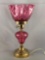 Vintage cranberry glass electrified table lamp with ruffle edge shade