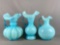 Group of three blue or pink glass ribbon edged pitchers