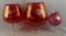 Group of three large etched cranberry glass compote