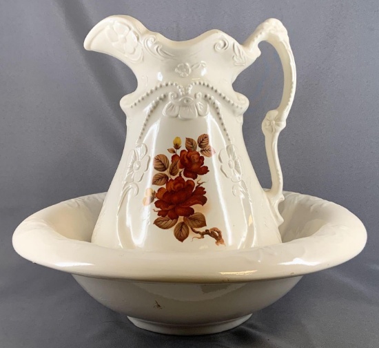 Vintage water pitcher and bowl with floral design