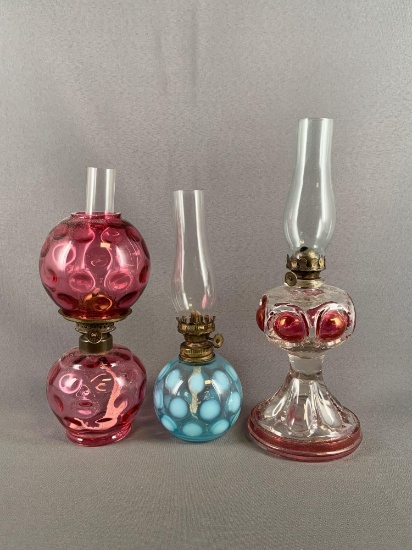 Group of three miniature glass oil lamps