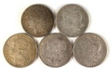 Group of five Morgan silver dollars