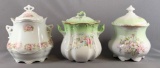 Group of three vintage biscuit jars with floral designs