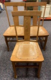 Group of three vintage oak dining room chairs