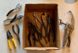 Group of pliers, vice grips, and more