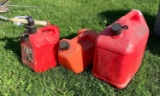 Group of three gas cans
