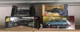 Group of 4 die-cast cars in original boxes