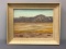 Framed artwork painting desert and mountains