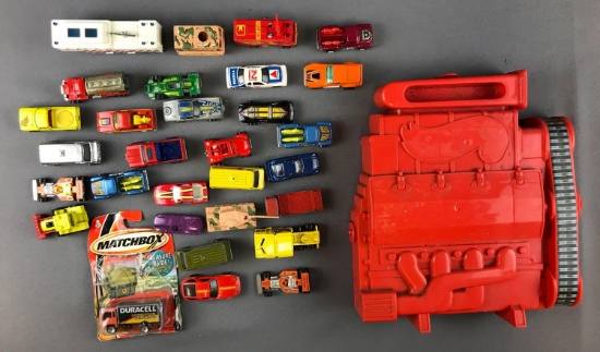 Group of Hot Wheels and Matchbox cars and carrying case