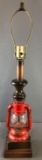 Vintage lamp with red Dietz lantern and wood base