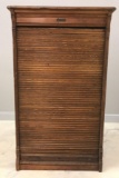 Antique wooden roll front cabinet