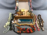 Group of costume jewelry with jewelry box