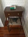 Vintage singer sewing machine with cabinet