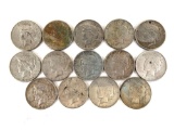 Group of 14 peace silver dollars