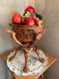 Carved wood bowl with stand and fruit